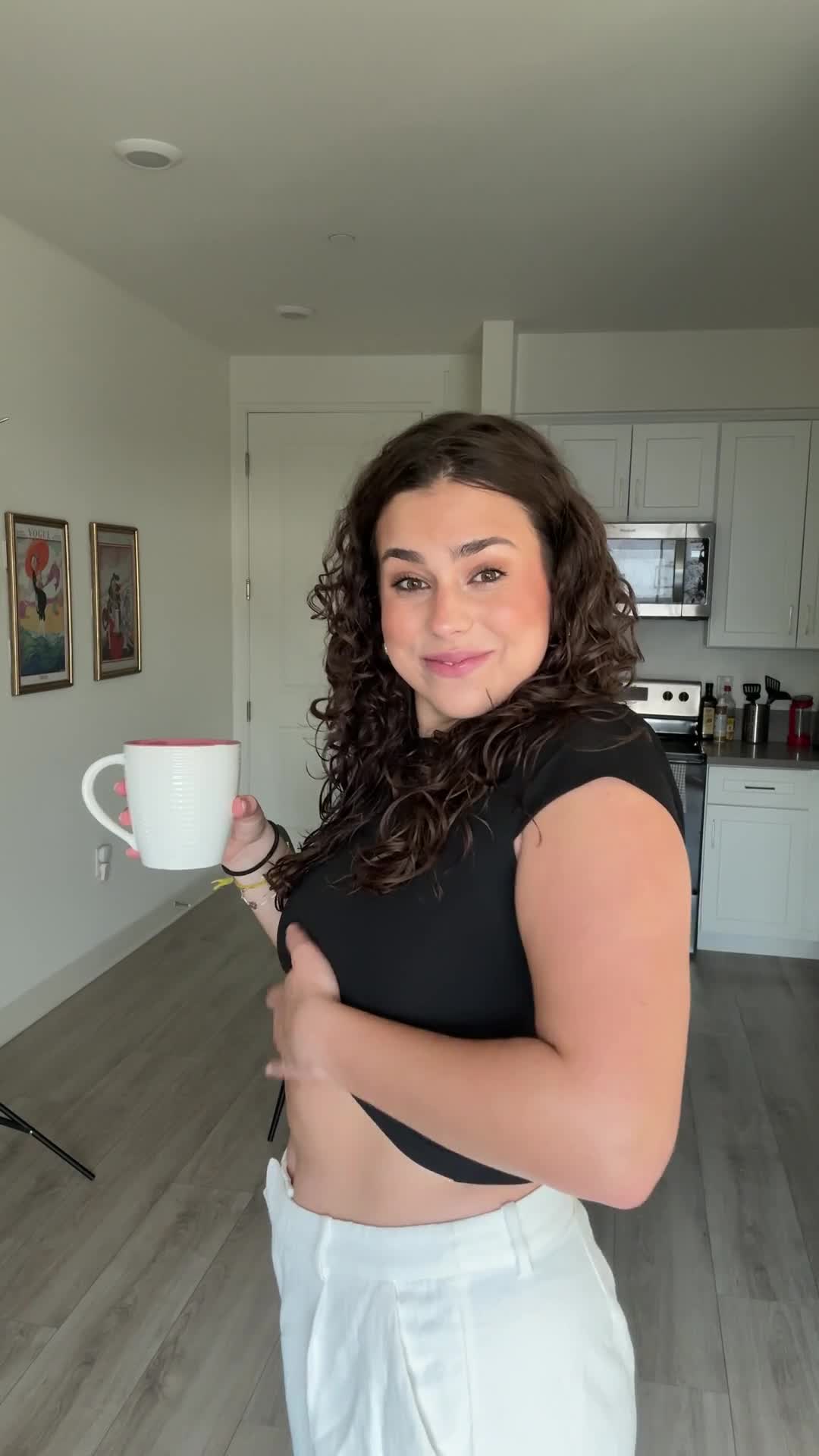 Lulutox customer with a cup of tea in her kitchen